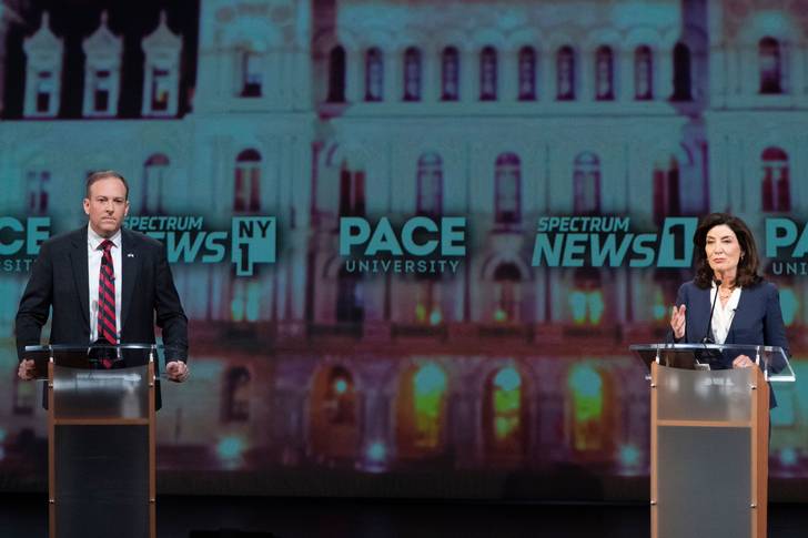 Republican candidate for New York Governor Lee Zeldin, at a podium to the left, participates in a debate against incumbent Democratic Gov. Kathy Hochul hosted by Spectrum News NY1 and WNYC, at Pace University in Manhattan.
